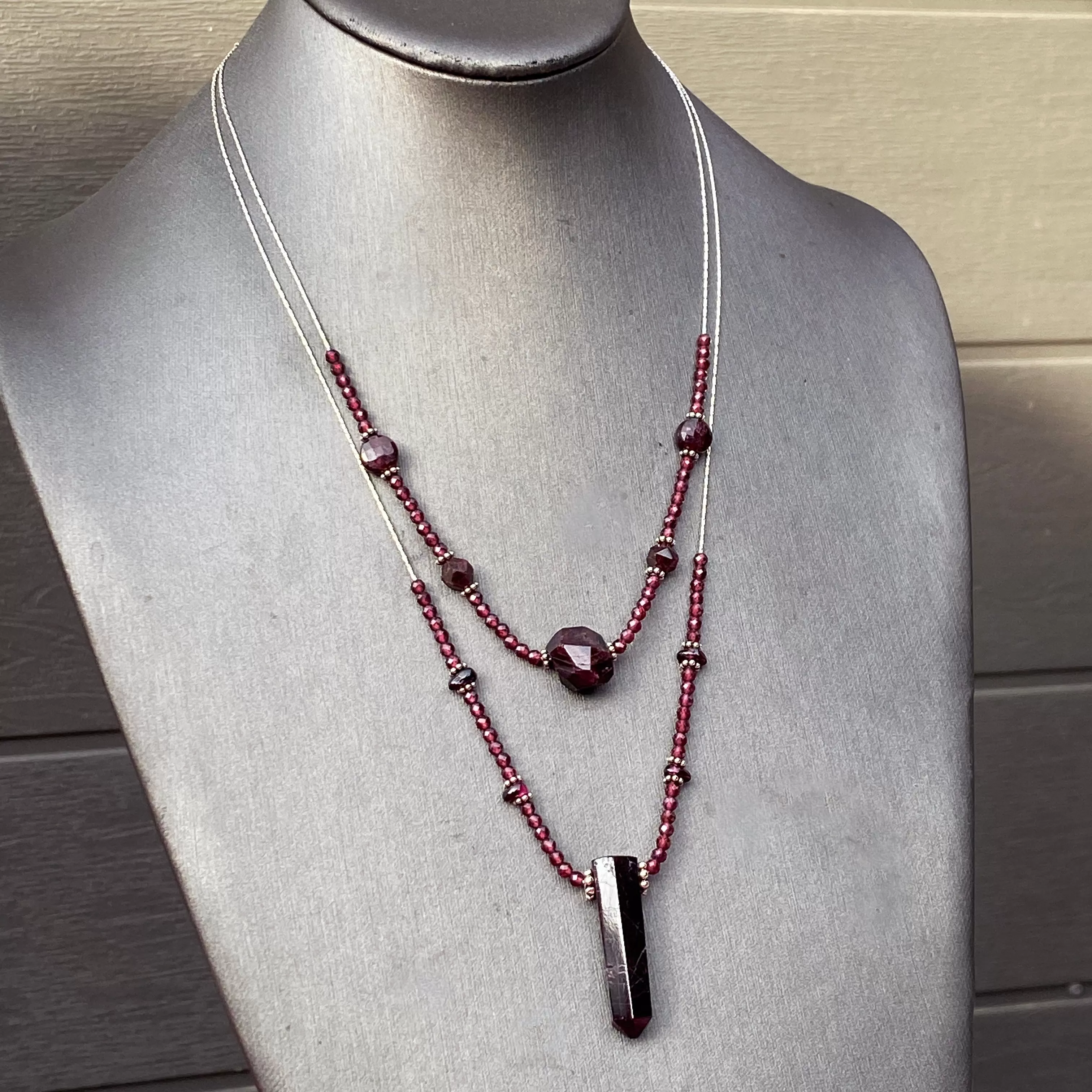 Garnet gemstones with sterling silver double strand necklace.